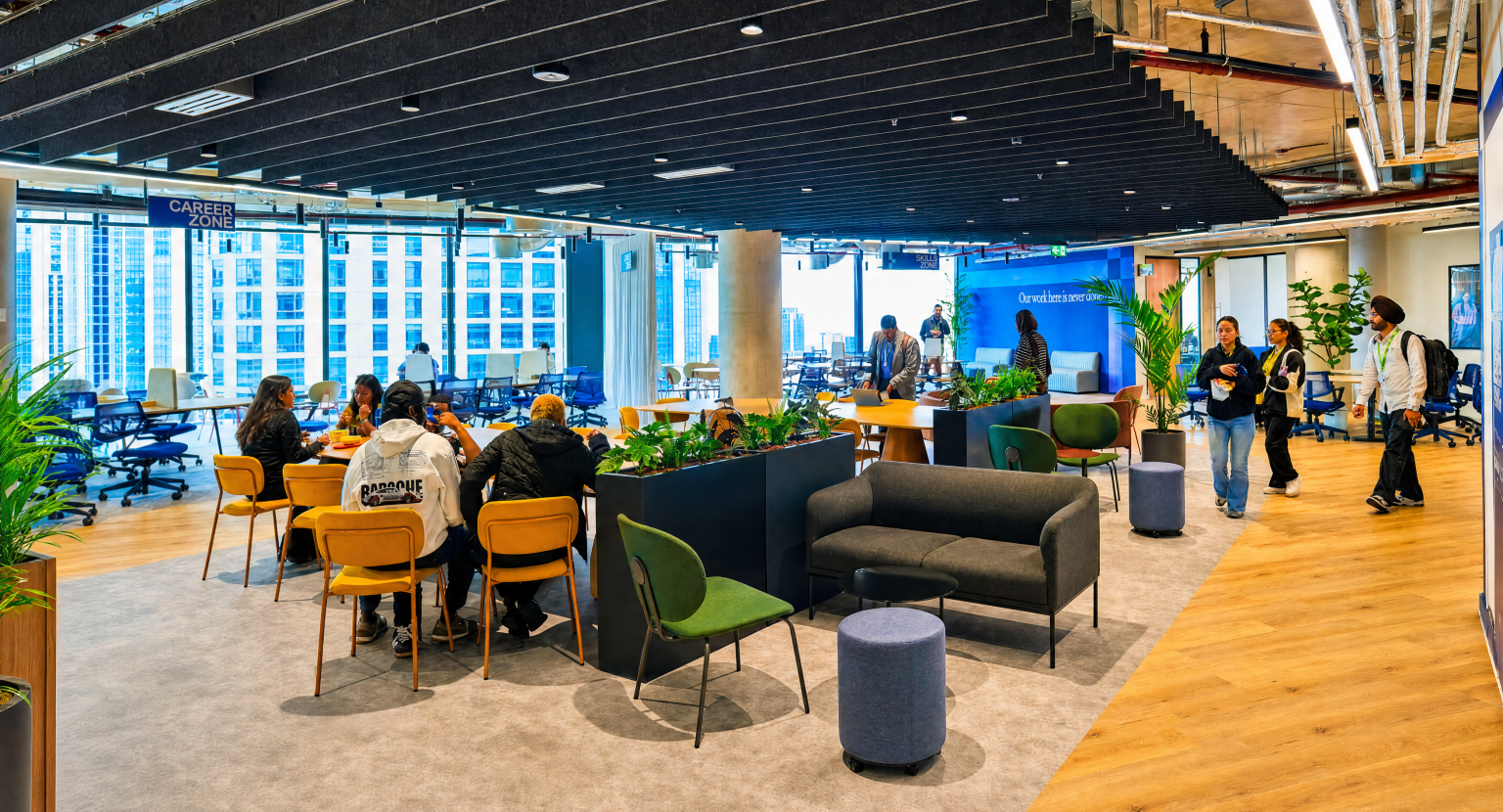 University of Hull London students within the new campus building, showcasing a modern, vibrant learning environment for students.